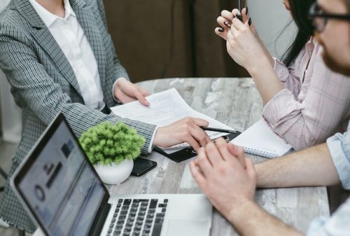 man and woman at table with lawyer