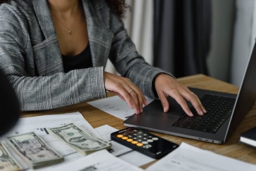 woman calculating money in divorce