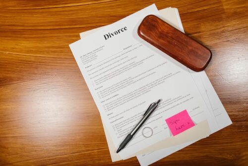 divorce papers pen and ring