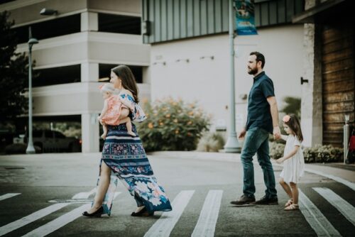 family walking in street