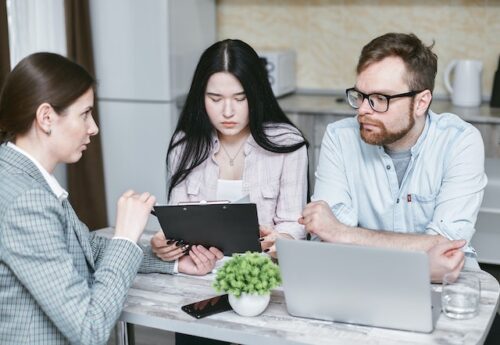 two people reviewing documents
