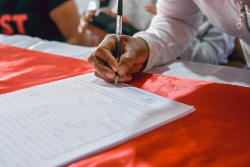 person signing papers