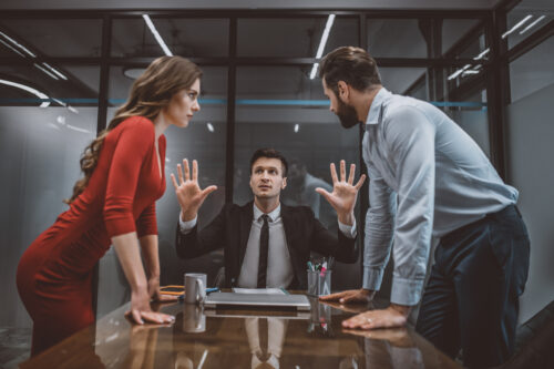 Hot argument. A lawyer trying to stop the argument between spouses